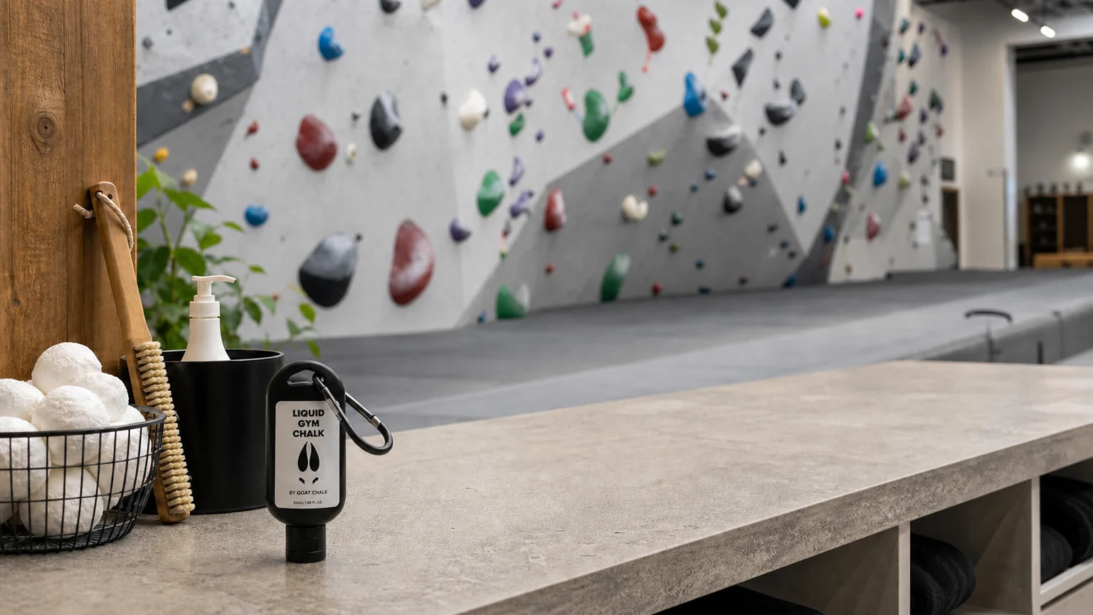 Goat Chalk liquid chalk bottle in a climbing gym chalk area