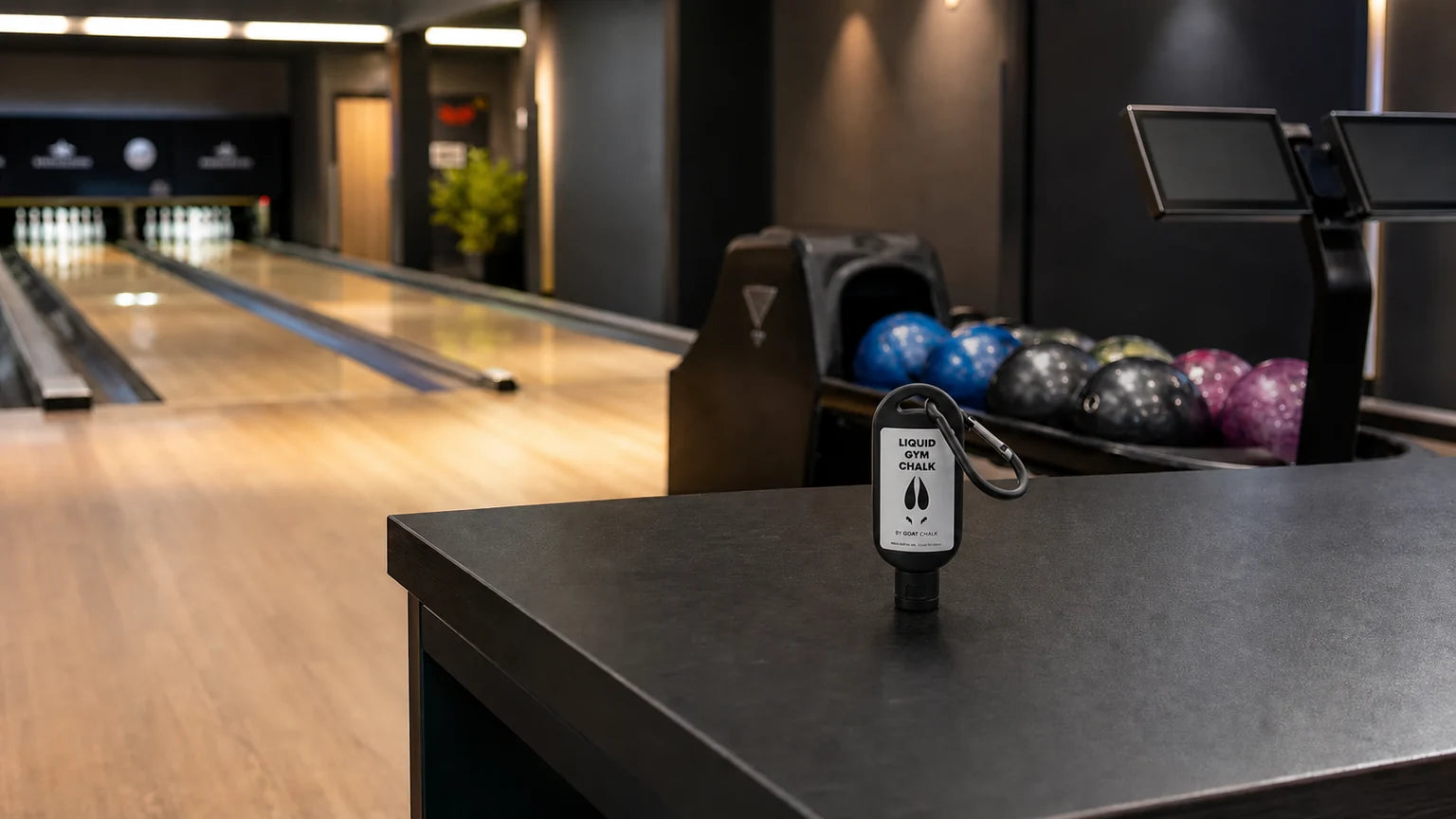 Goat Chalk liquid chalk bottle in a bowling practice facility